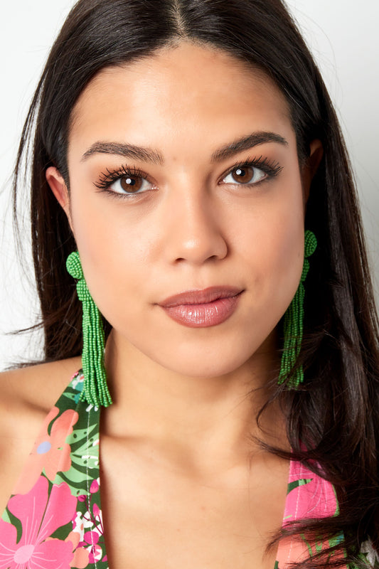 Green tassel statement earrings illustration