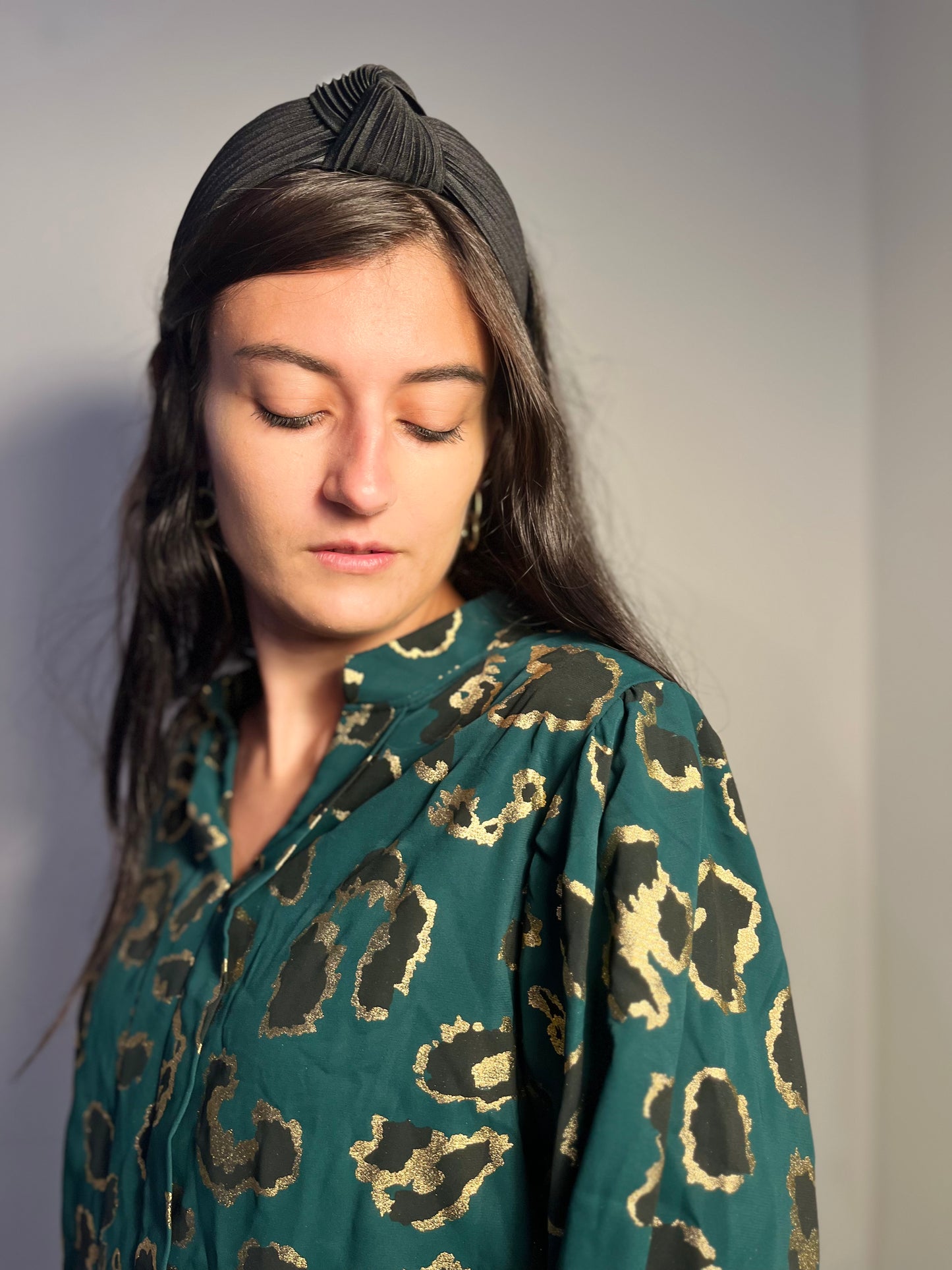 Emerald green blouse with golden leopard details
