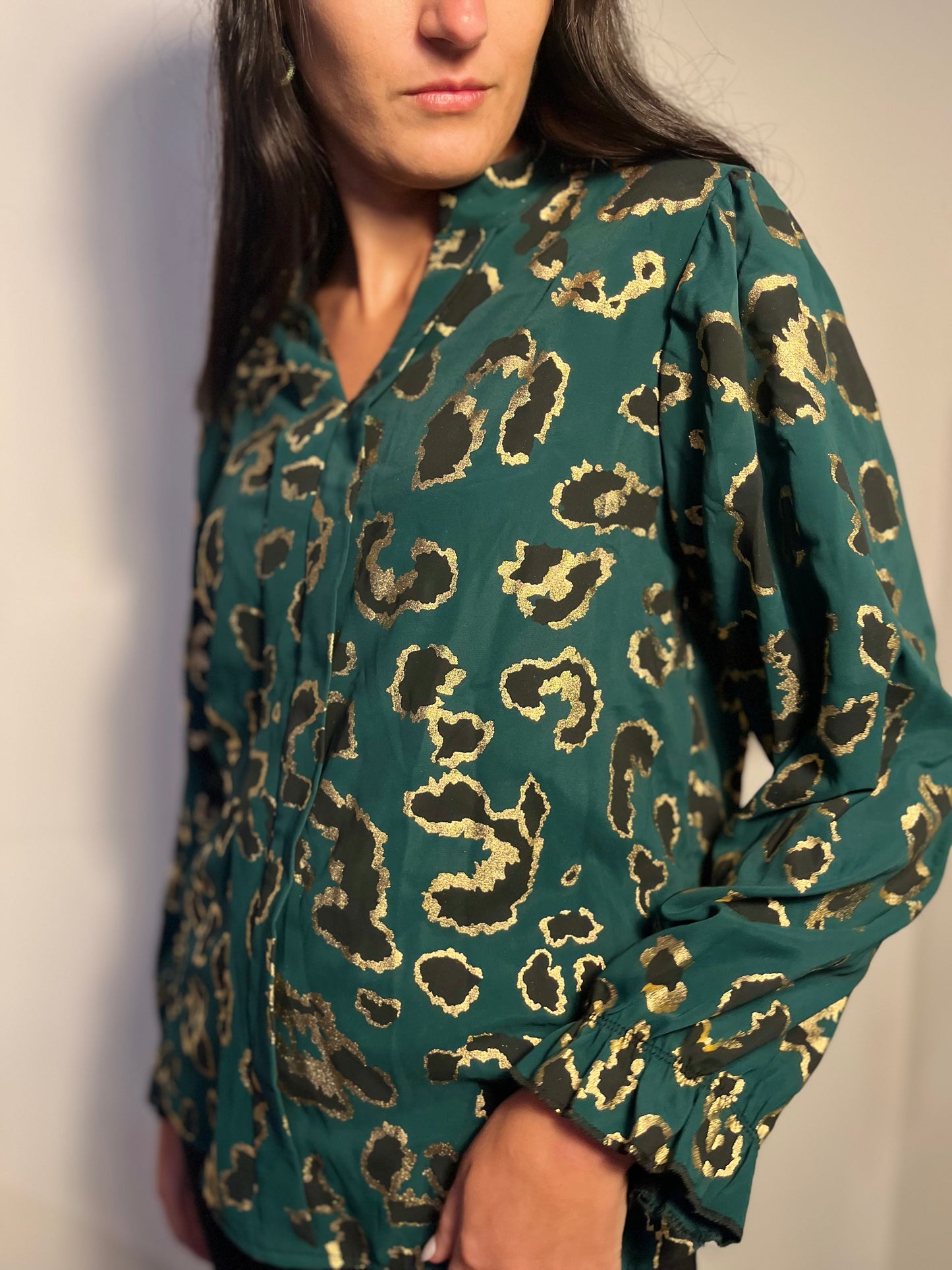 Emerald green blouse with golden leopard details